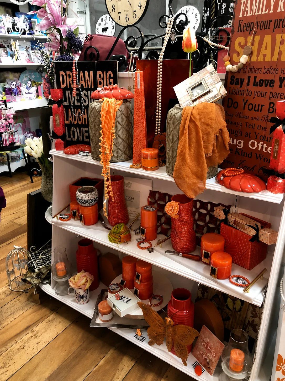 Candles and home fragrance stacked on the display shelf