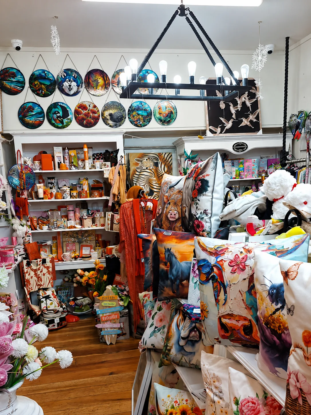 Cushions, wall art and throws in the corner display