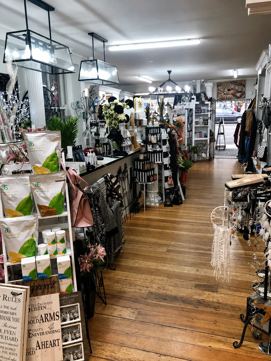 Clothing racks and accessories through the middle of the shop