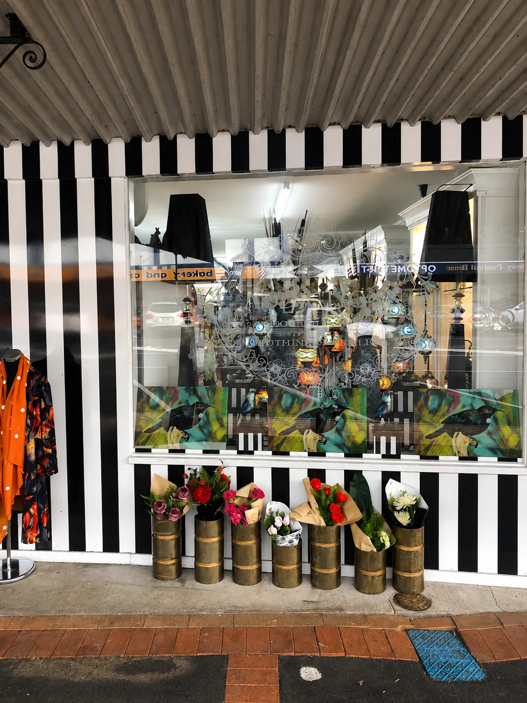 The black and white striped shopfront of Addictions on Whitaker Street, Te Aroha